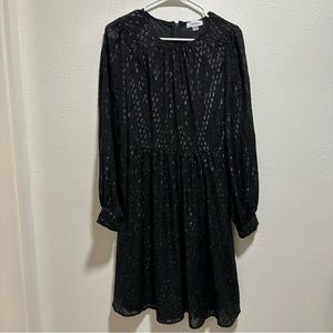 Calvin Klein size 6 Mid length, long sleeve black dress.
